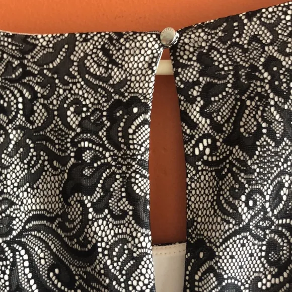 EXPRESS A line sleeveless tan and black floral laced design midi dress size L.