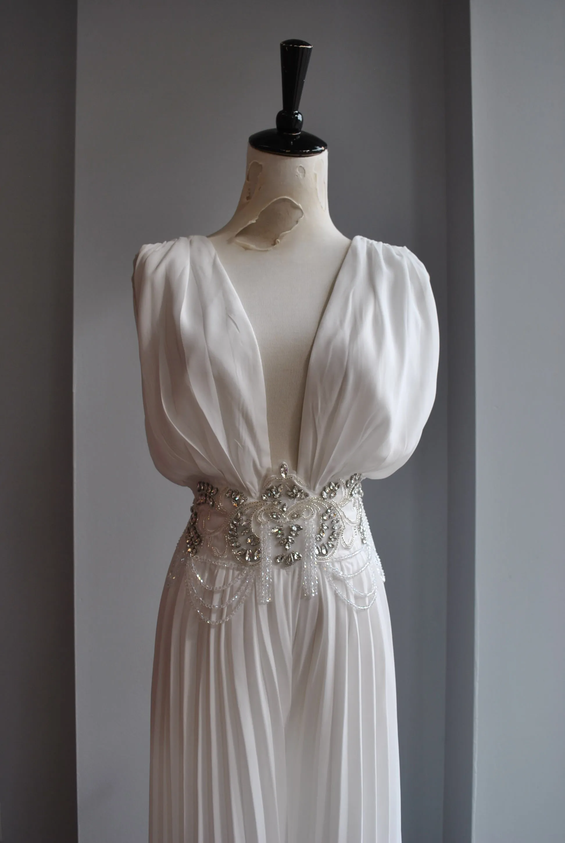 WHITE PLEATED JUMPSUIT WITH CRYSTALS